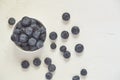 Top view of bowl with blueberries on white concrete background Royalty Free Stock Photo