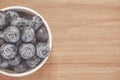 Top view of bowl with blueberries on wooden desk Royalty Free Stock Photo