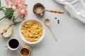 top view of bowl of cereal with coffee and flowers bouquet