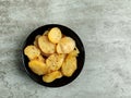 Top view of a bowl of fried potatoes on marble surface Royalty Free Stock Photo