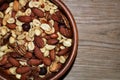 Top View of a Bowl of Mixed Nuts on a Wood Table Royalty Free Stock Photo