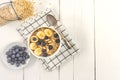 Top view of Bowl of oatmeal wirh blueberry and sliced banana on wooden table. Copy space Royalty Free Stock Photo