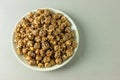 Top view of a bowl of popcorn with caramel and cocoa frosting Royalty Free Stock Photo