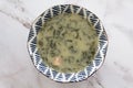 Top view of bowl with portuguese kale soup called caldo verde Royalty Free Stock Photo