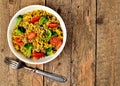 Top view of bowl with tuna risotto with vegetables, tomatoes, broccoli and parsley Royalty Free Stock Photo