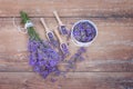 Top view of a bowl and wooden spoons with fresh lavender flowers and a bouquet of lavender Royalty Free Stock Photo