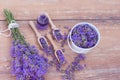 Top view of a bowl and wooden spoons with fresh lavender flowers, lavender essential oil and a bouquet of lavender Royalty Free Stock Photo