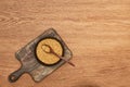 Top view of bowls whole grains with spoon on wooden cutting board.