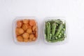 Top view of boxes with fresh chopped carrots and green fresh peas.Concept of healthy eating Royalty Free Stock Photo