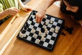 Top view boy and girl playing chess