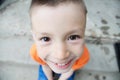 Top view boy portrait close-up . Smiling child face. Caucasian kid. fisheye effect. fish-eyed shot