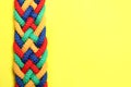 Top view of braided colorful ropes on background, space for text. Unity concept Royalty Free Stock Photo