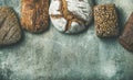 Top view of bread loaves over grey background, copy space Royalty Free Stock Photo