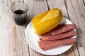 Top view of Bread and slices of mortadella on the wooden table Royalty Free Stock Photo