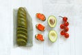 Top view of a bread with spinach, salmon, avocado and tomatoes