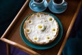 Top view - breakfast in bed a delicious cheesecake and two cups of coffee are on a wooden tray Royalty Free Stock Photo