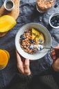 Top view of breakfast table for two persons, crunchy granola with fresh berries and cream or milk. Royalty Free Stock Photo