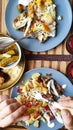 Top view breakfast for two, baked fish and potatoes and male hands with a fork, English breakfast, healthy eating concept, Royalty Free Stock Photo