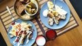 Top view breakfast for two, baked fish and potatoes with pickles, English breakfast, healthy eating concept, selective focus Royalty Free Stock Photo