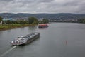 Top view from a bridge across the river rhine to a tank vessel with a container ship in background