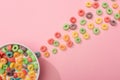 Top view of bright colorful breakfast cereal with milk in bowl and around Royalty Free Stock Photo