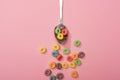 Top view of bright colorful breakfast cereal scattered from spoon Royalty Free Stock Photo