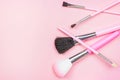 Top view of bright pink decorative cosmetics tools and accessories for professional make up and visage on light background Royalty Free Stock Photo