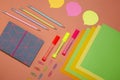 Top view of bright stationery pieces on the oramge surface.Organized office supplies Royalty Free Stock Photo