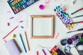 Top view Bright workplace of creative artist mockup. Blank canvas surrounded by variety of drawing supplies. Art, workshop,