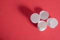 Broken eggshells on a vibrant red background. Top view Royalty Free Stock Photo