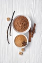 Top view of brown cinnamon granulated and cane cubes sugar with cocoa powder and spices for confectionery Royalty Free Stock Photo