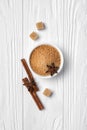 Top view of brown cinnamon granulated and cane cubes sugar with spices for confectionery Royalty Free Stock Photo