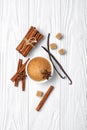 Top view of brown cinnamon granulated and cane cubes sugar with spices on white wooden background Royalty Free Stock Photo