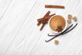 Top view of brown cinnamon granulated and cane cubes sugar with spices on white wooden background Royalty Free Stock Photo