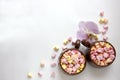 Top view of brown cups of hot cocoa with marshmallows in heart shape on white background Royalty Free Stock Photo