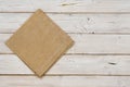 Top view of brown kitchen napkin on wooden planks background Royalty Free Stock Photo