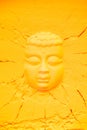 top view of buddha head shape on orange flour texture Royalty Free Stock Photo