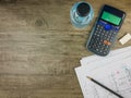 Top view building plan,stationery and calculator on grey wooden background Royalty Free Stock Photo