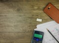 Top view building plan,stationery and calculator on grey wooden background Royalty Free Stock Photo