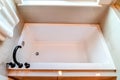 Top view of a built in rectangular bathtub inside the clean bathroom of a home Royalty Free Stock Photo