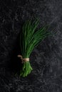 top view of bunch of chives on concrete table, healthy Royalty Free Stock Photo