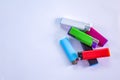 Top view of a bunch of different colors and designs of lighters. Gas, plastic disposable gas lighters. 123 Royalty Free Stock Photo