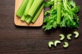 Top view of bunch of fresh sliced celery stalk on wooden table with leaves. Food and ingredients  of healthy vegetable. Freshness Royalty Free Stock Photo