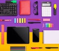 Modern working place with tablet, calculator, notebook and smartphone on purple and orange background. Business concept Royalty Free Stock Photo