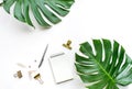 Top view of business desk table with monstera leaves and mock up accessories Royalty Free Stock Photo