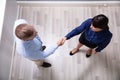 Top View Of Business Partners Shaking Hands Royalty Free Stock Photo