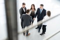 Top view of business people shaking hands, finishing up a meeting - Welcome to business. Royalty Free Stock Photo