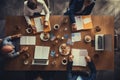 Top view of business people sitting and discussing at meeting table in office, Business meeting on a working table, top view, with Royalty Free Stock Photo