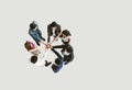 Top view of business people standing with their hands together in a huddle stack hand teamwork assemble together. Royalty Free Stock Photo