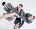 Top view .the business team helps the leader to rise up.